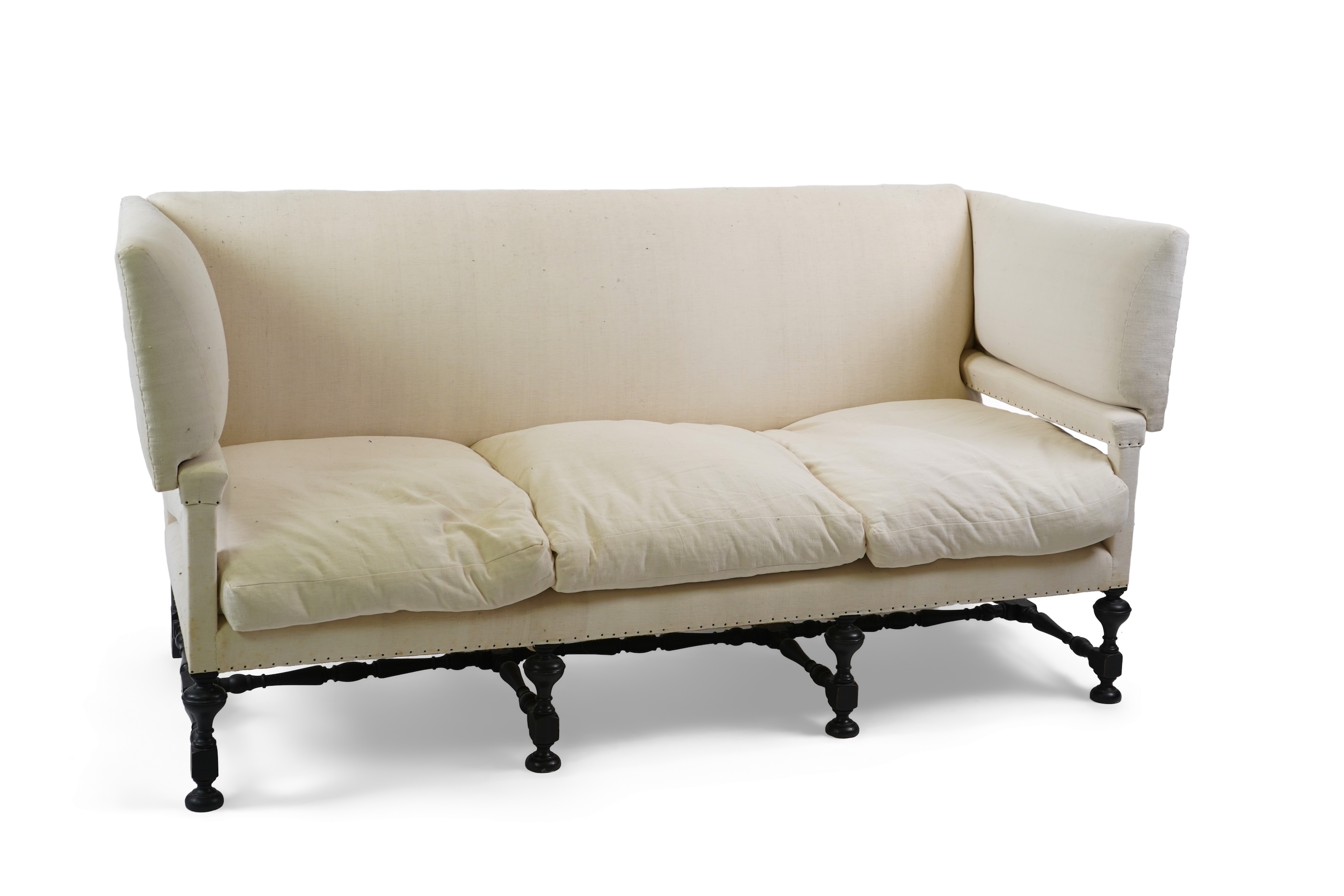 A Jacobean revival Knowle type three seater sofa